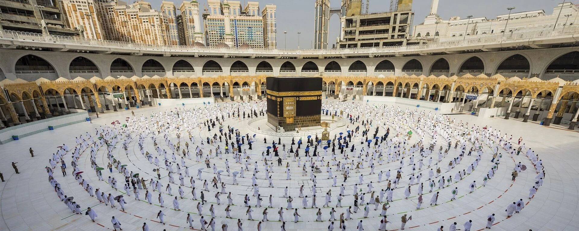 Night view of the Holy Kaaba surrounded by thousands of pilgrims performing Tawaf in Masjid al-Haram, Makkah